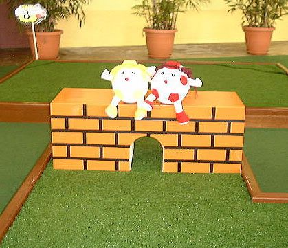 miniature golf hole 8 putting with humpy dumpty sitting on a wall