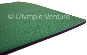 side view of green rubberized floor that comes in rolls.