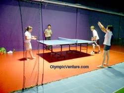 Installed Olymflex rubberized floor for ping pong playing area with table of metal legs for Sports Arena Sentosa, Old Klang Road