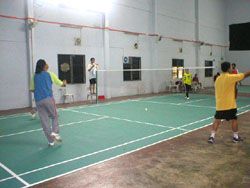 Badminton court with players