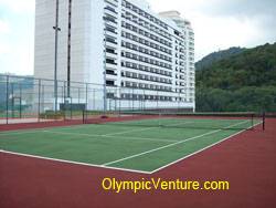 another view of rubberized cushioned tennis court for Equatorial Hotel